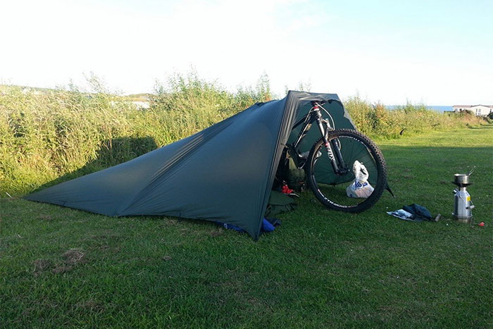 DD Tarp 3x3 used to shelter a mountain bike