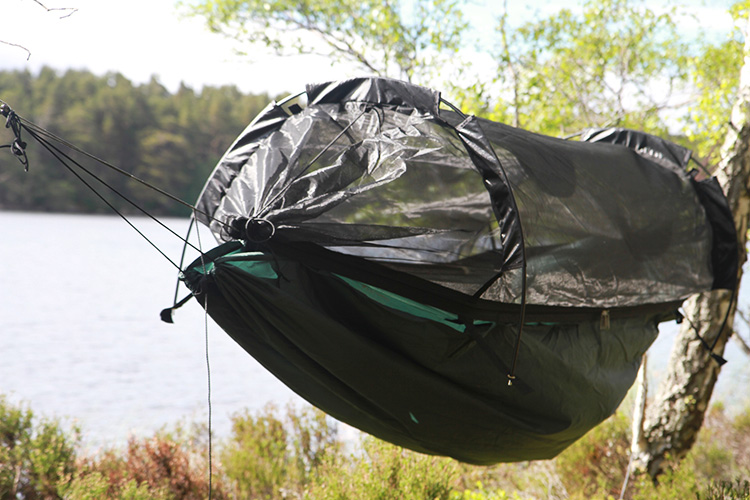 DD SuperLight Jungle Hammock with mosquito net by a highland loch