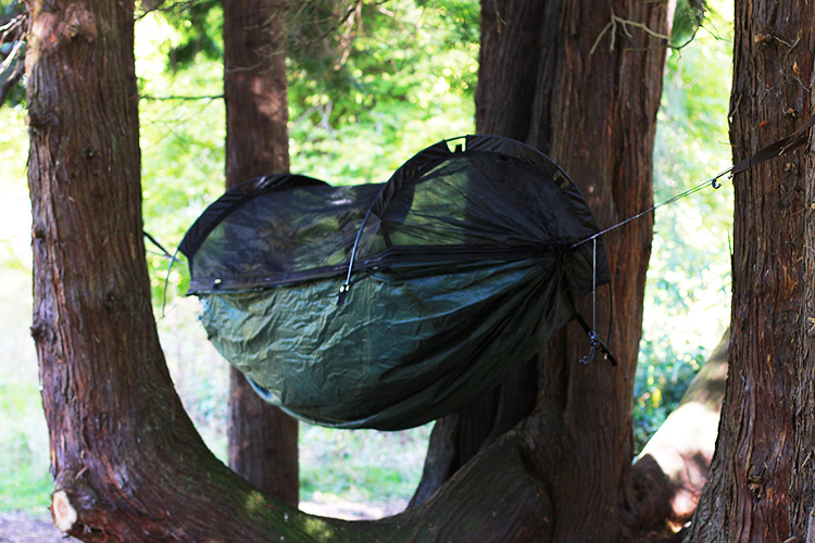 DD SuperLight Jungle Hammock with mosquito net in the woods