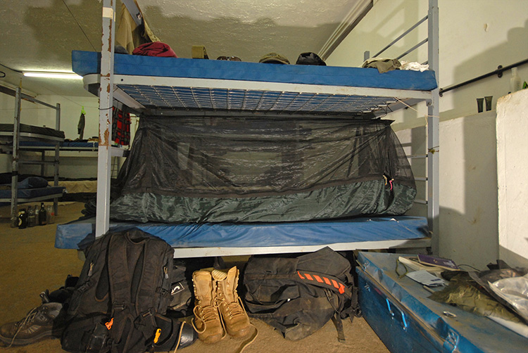 DD Travel Hammock / bivi on a bed with mosquito net