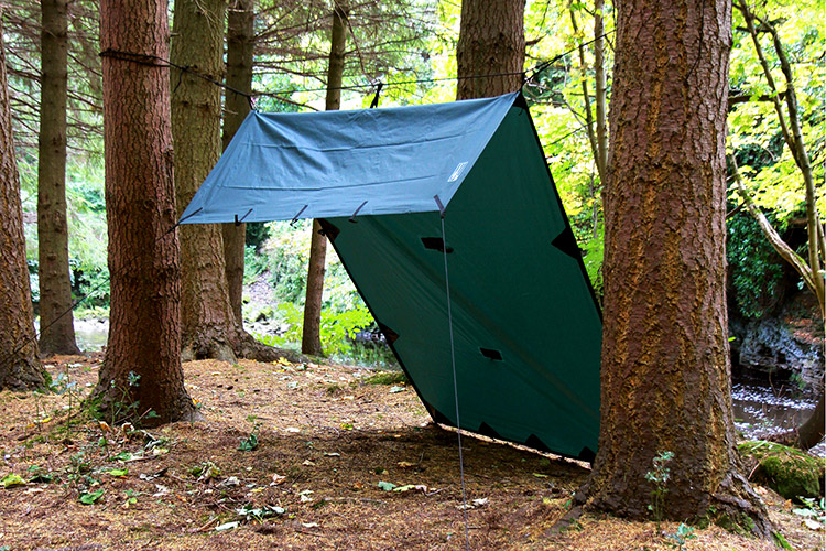 DD Tarp S olive green set up outdoors in lean-to formation